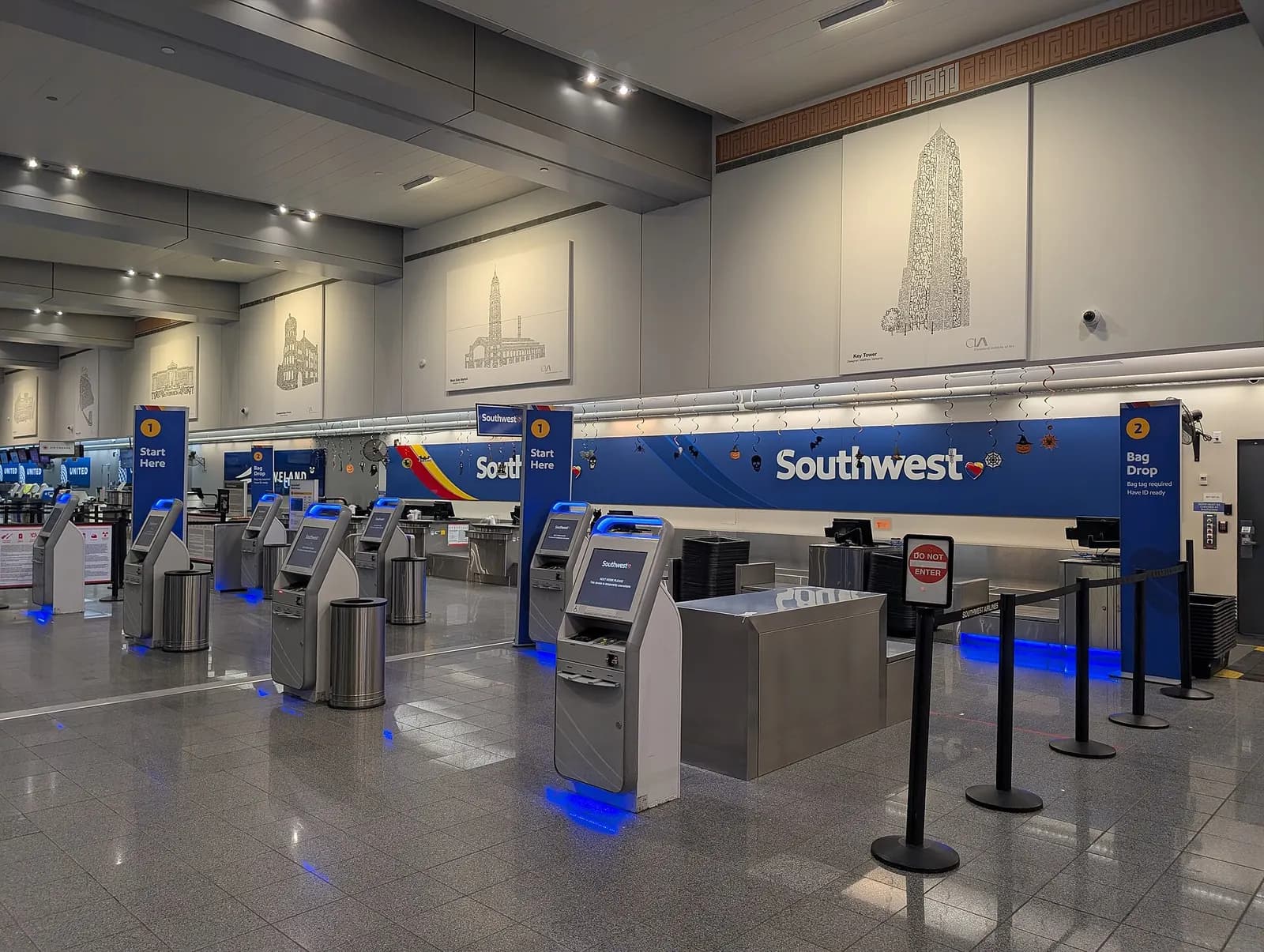 The Southwest Airlines check-in area in the Cleveland Hopkins International Airport , captured at night once check-in is not active.