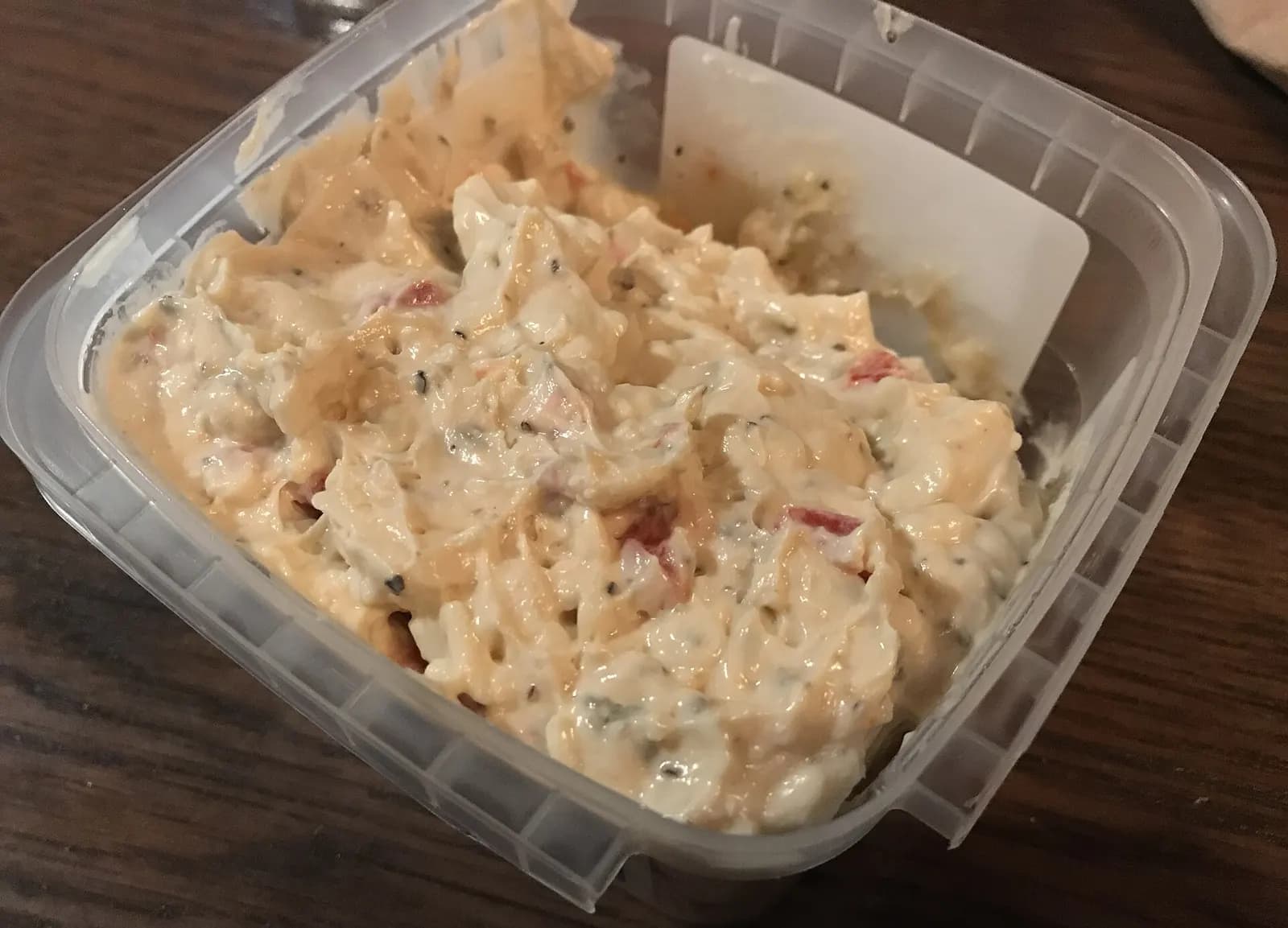 A serving of pimento cheese with crackers at a food counter inside Charlotte Douglas International Airport.