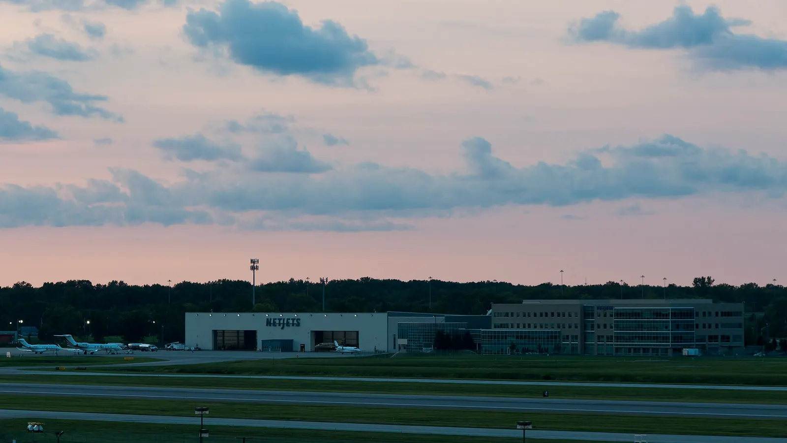 NetJets Headquarters at John Glen Columbus International Airport (KCMH). Viewed from the SE at sunset - 8:23 PM local time. The facility was constructed in 04 04, 2012.