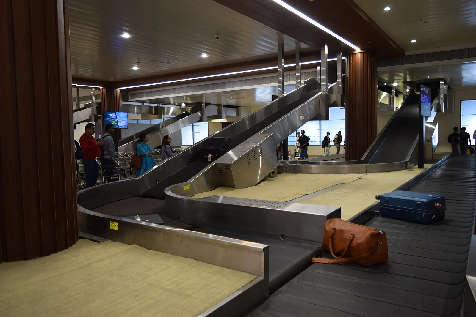Domestic Terminal 1 baggage claim with IndiGo branding at Cochin International Airport
