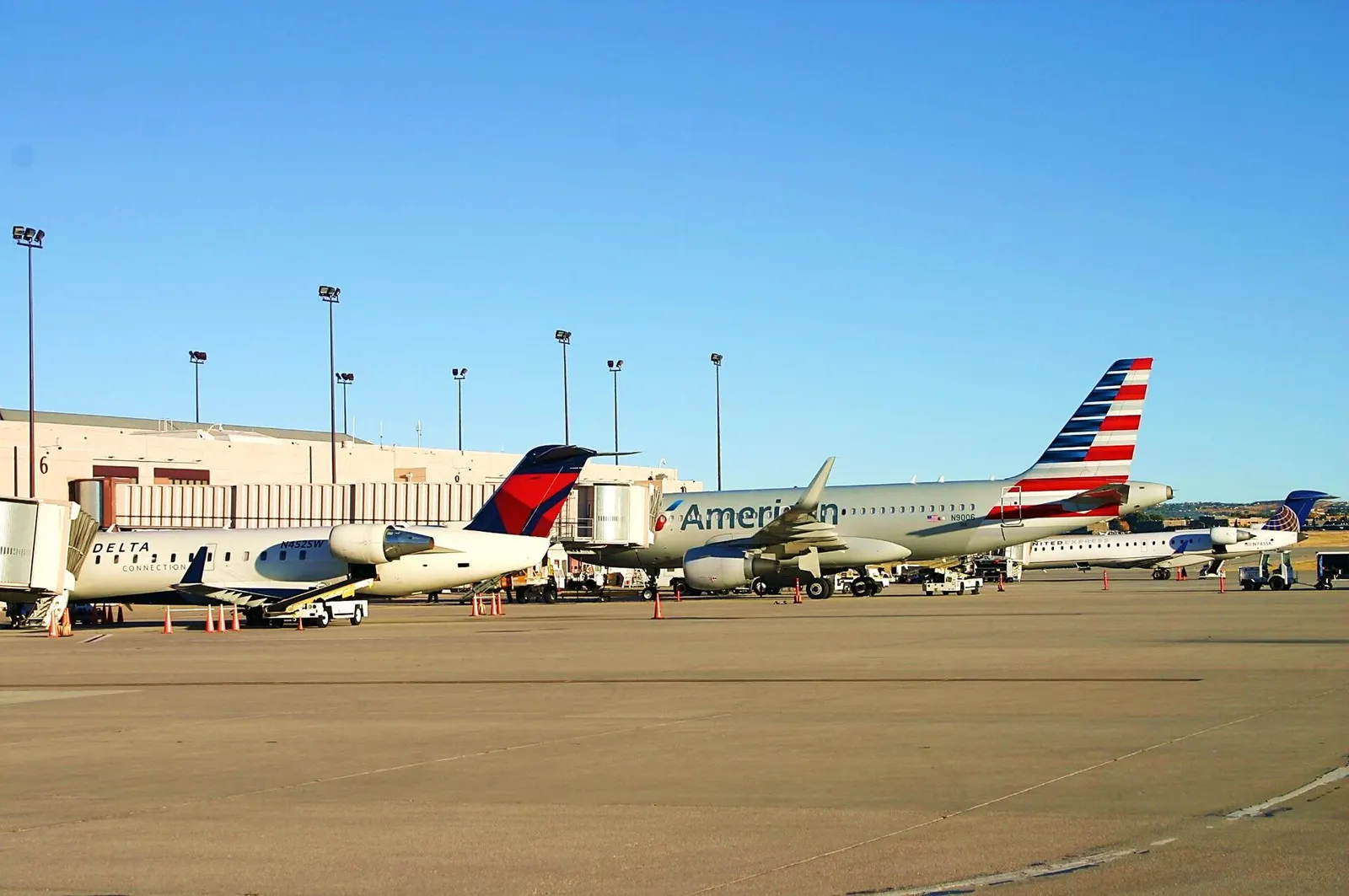 October 2014 morning ramp at Colorado Springs Airport with airliners parked at the civil concourse.