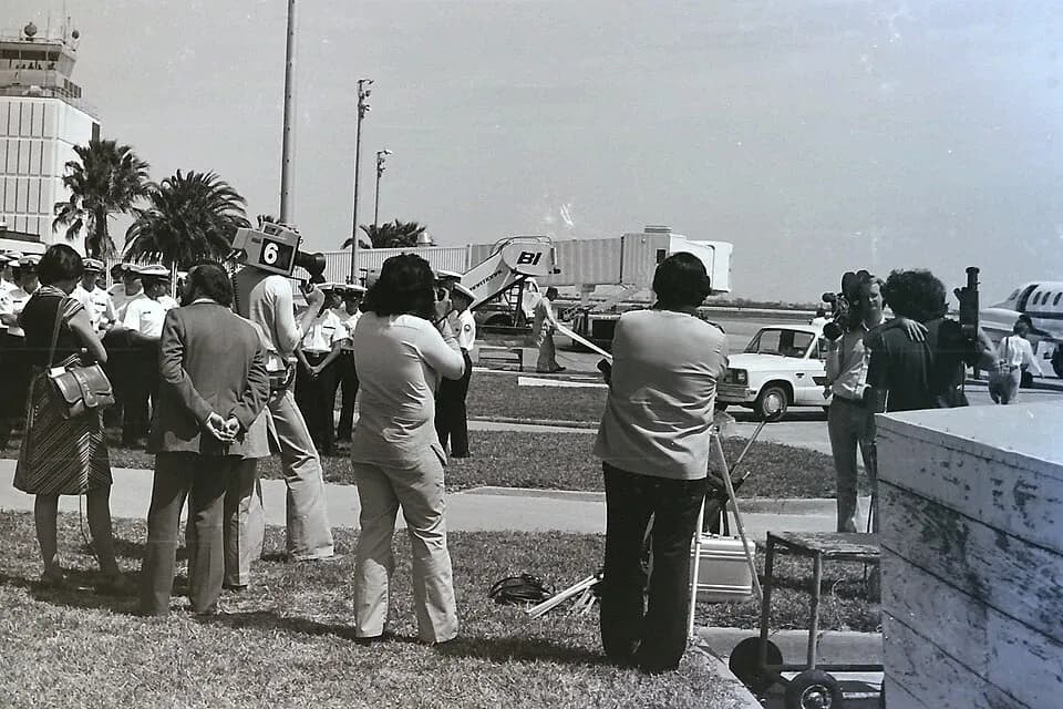 1976 Corpus Christi airport curb with palms, control tower, and Channel 6 news cameras