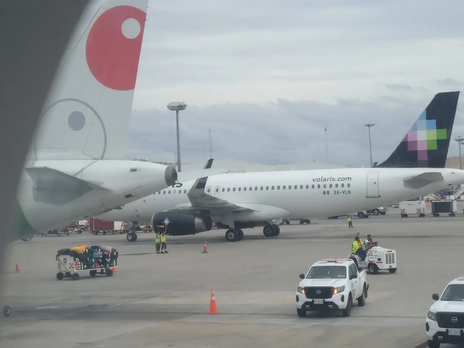 Volaris and VivaAerobus aircraft at Cancun International Airport