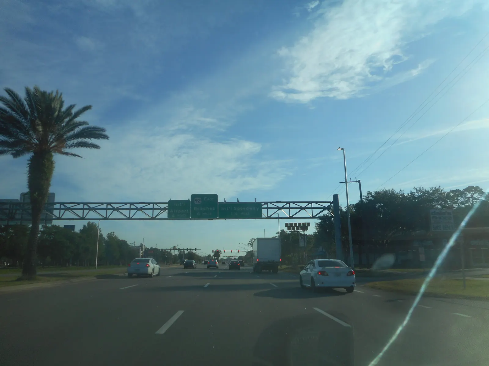 May 2021 US-92 gantry pointing to Daytona International Speedway, the airport, and the beach