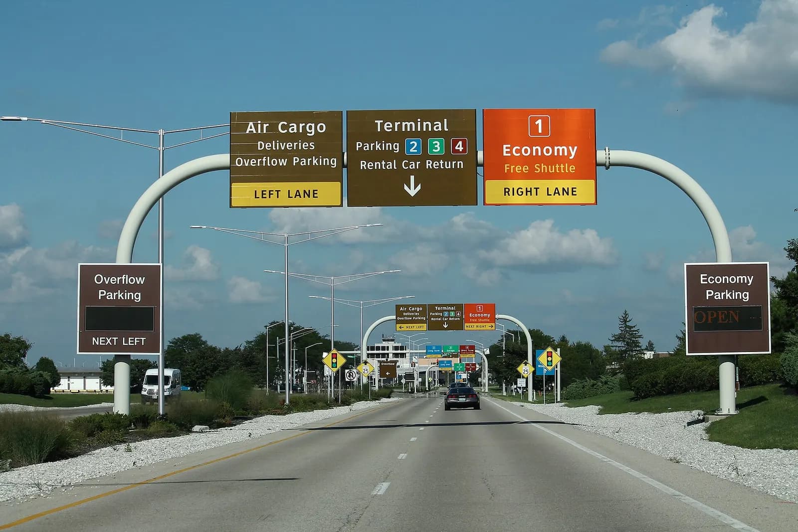 September 2018 Dayton International Airport entrance road with overhead wayfinding on Airport Access Road.