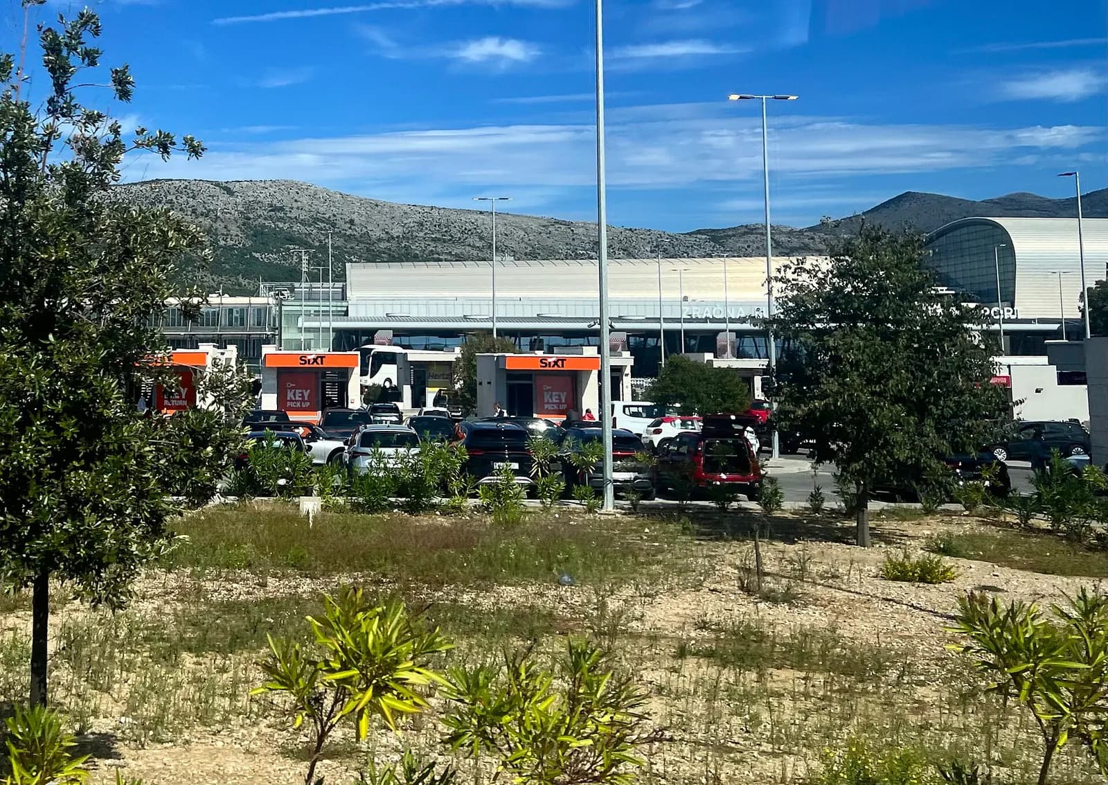 Car rental booths and landside approach at Dubrovnik Airport