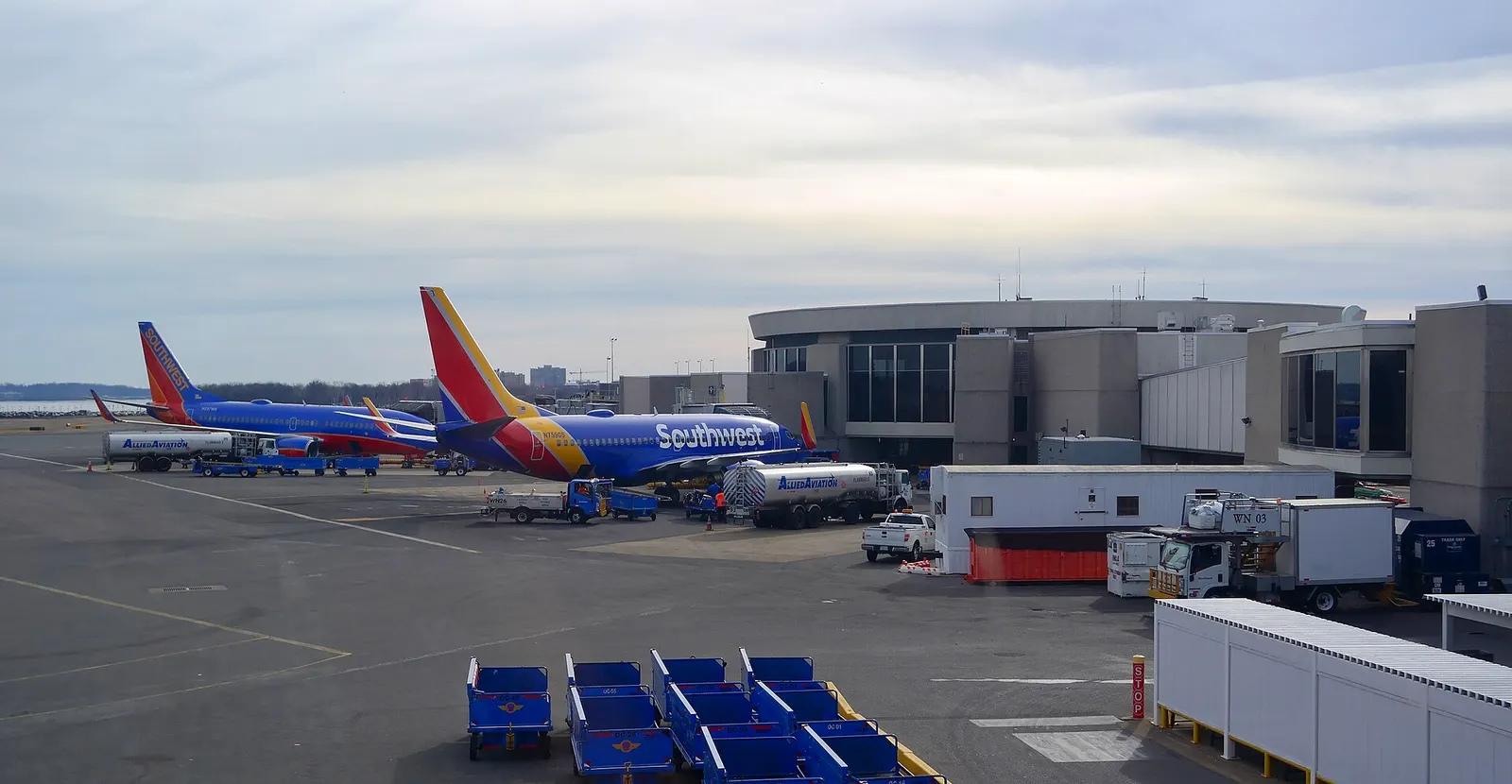 Southwest Airlines Boeing 737s parked at the terminal A satellite at Ronald Reagan Washington National airport. The satellite was built by Northwest Airlines and TWA as part of their unit terminal at National, opening in 1970. It was designed by Giuliani & Associates.
