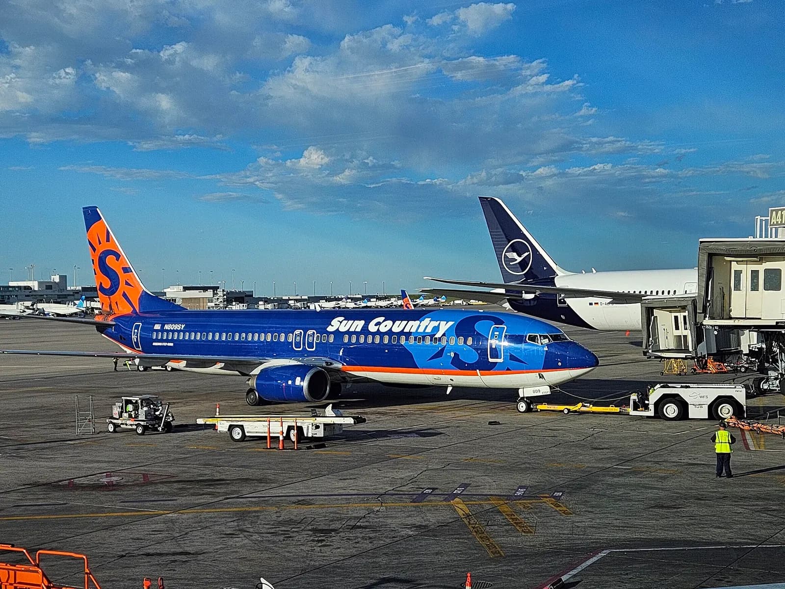 Sun Country Airlines Boeing 737-800 parked at Concourse A at Denver International Airport .