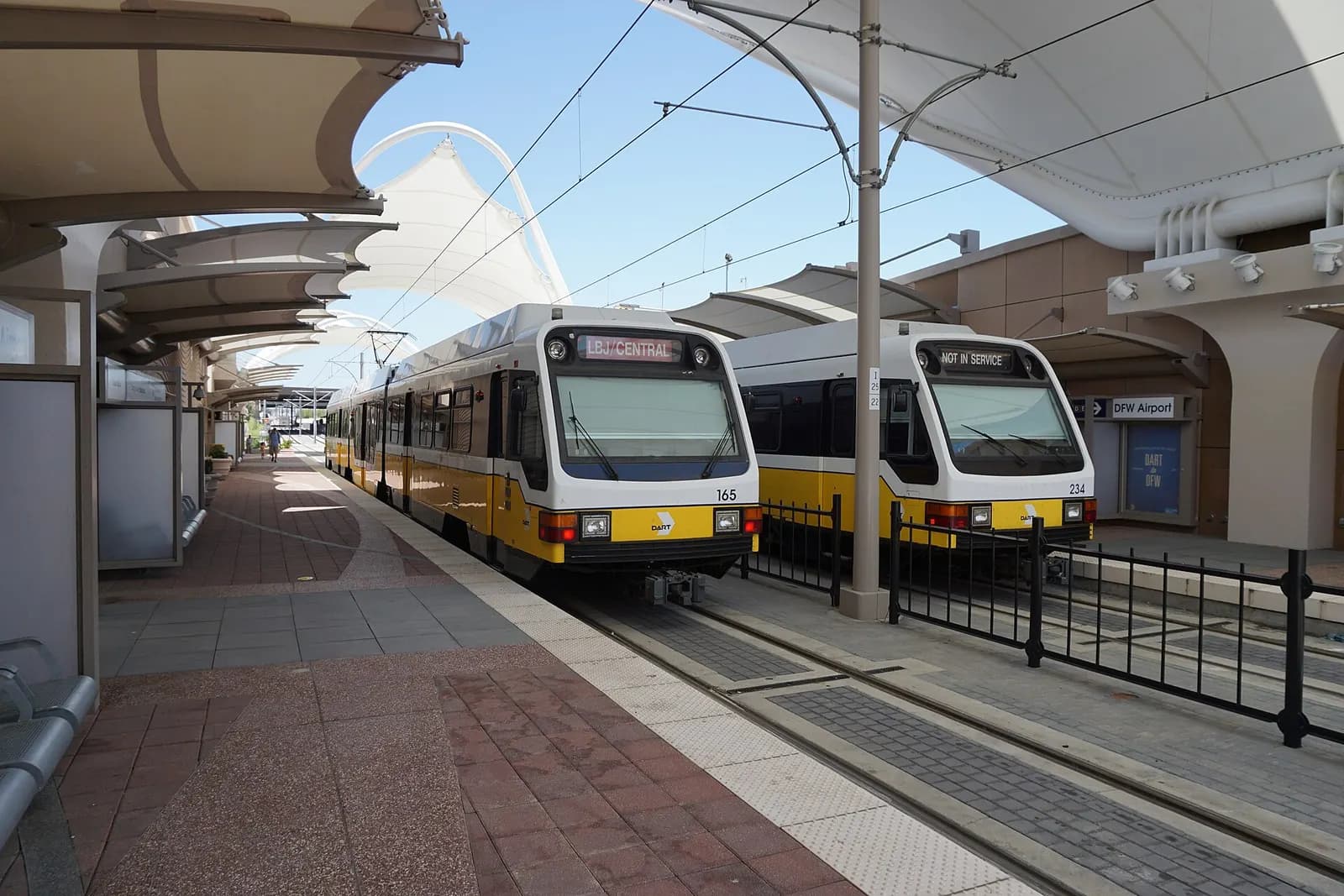 A DART Light Rail Orange Line train at DFW Airport Station at Dallas/Fort Worth International Airport in Texas ( United States ).