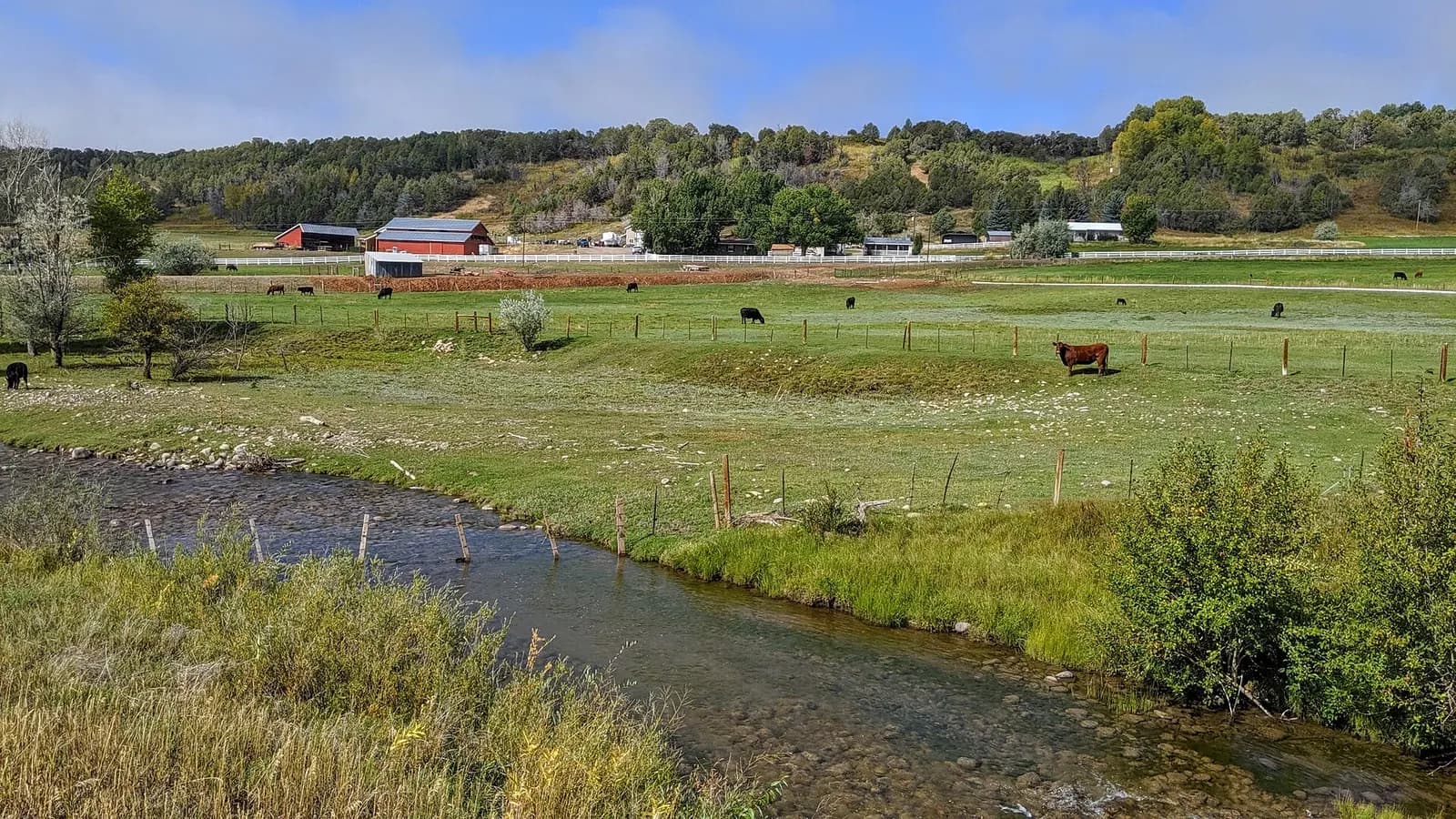 Colorado Highway 172 at the Florida River near Durango-La Plata County Airport, with pasture and a farmhouse.