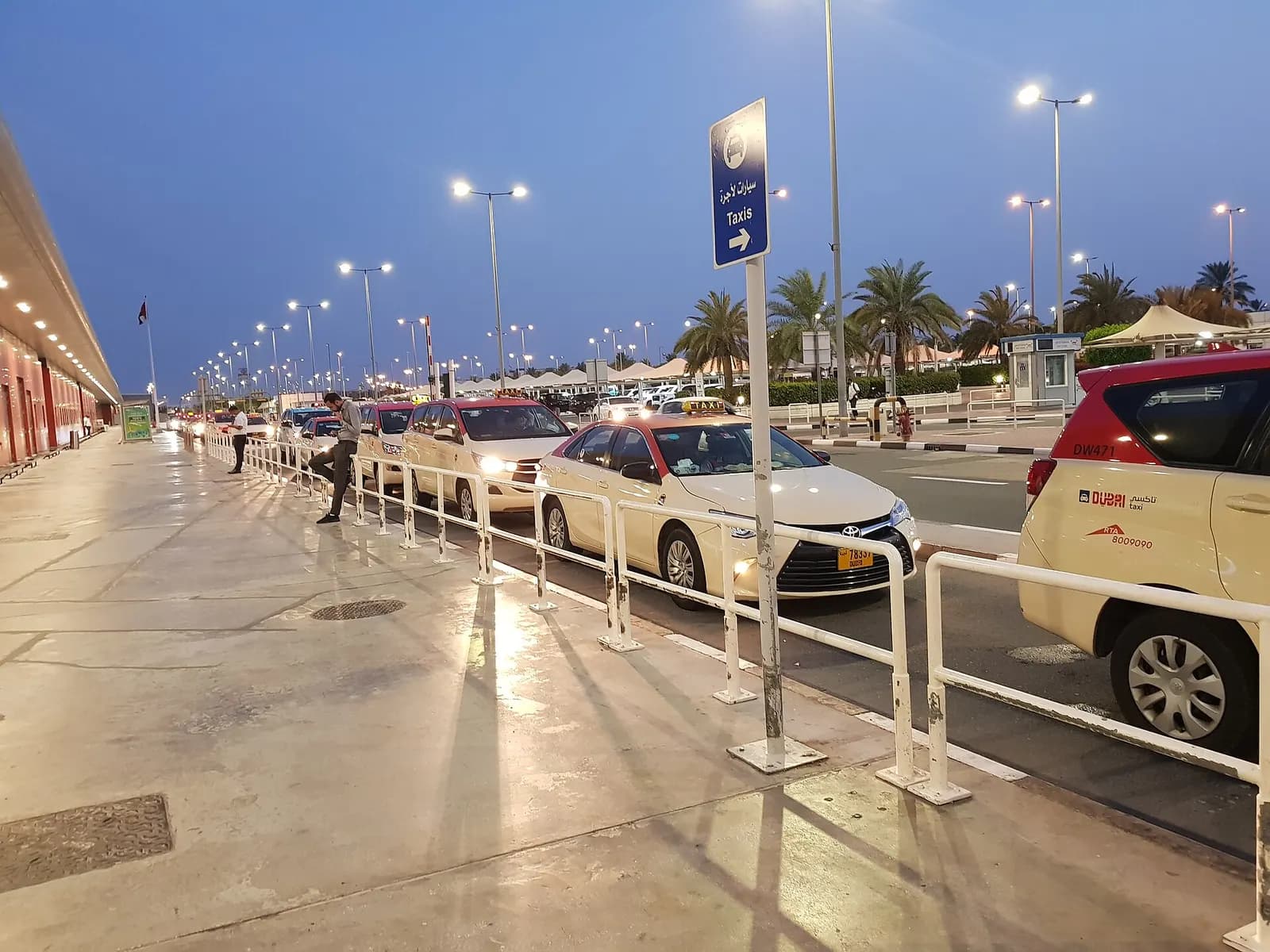 Early-morning exterior of Terminal 2 with its entrance canopy and access roadway.