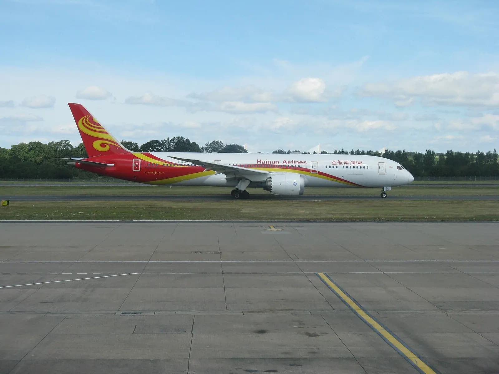 A large wide-body airliner prepared for departure on the Edinburgh Airport apron, identified as the service to Beijing.
