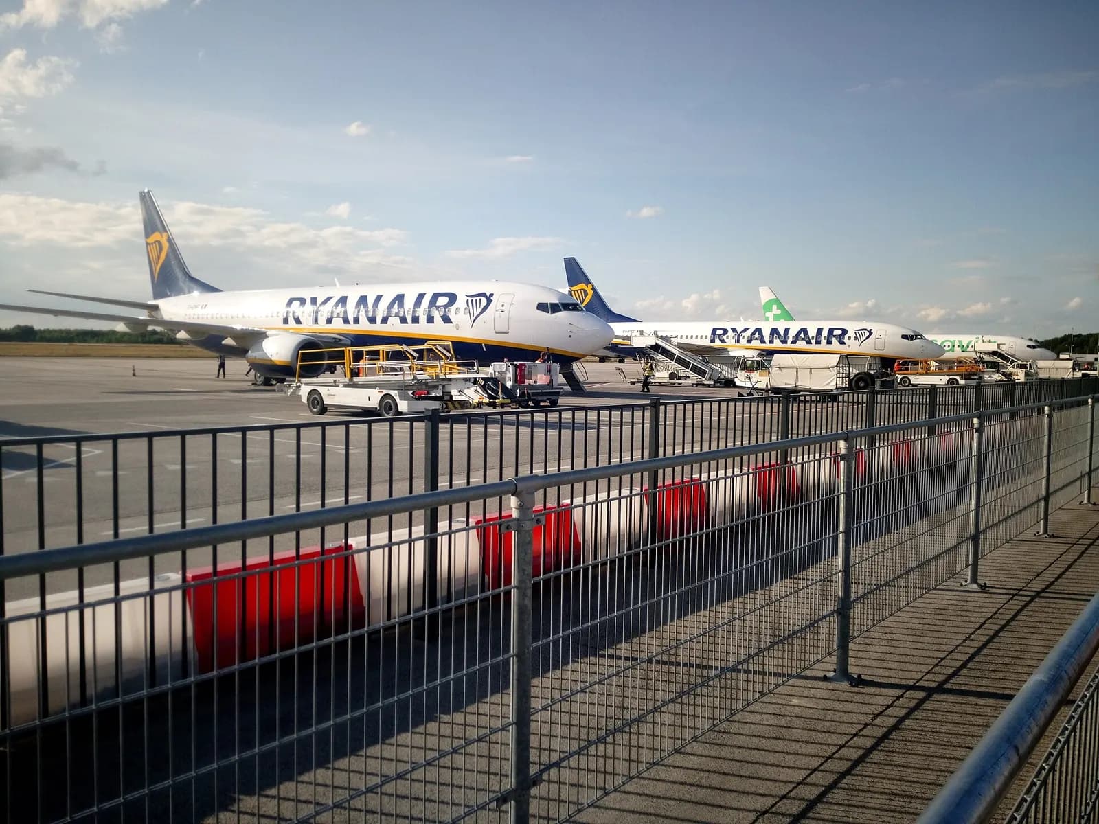 Two Ryanair Boeing 737 aircraft parked on the apron at Eindhoven Airport.