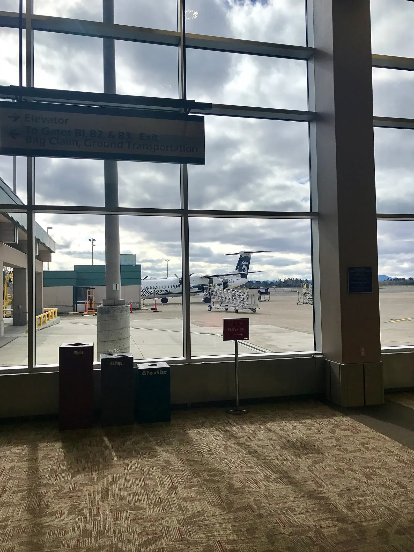 Horizon Q400 on the ramp seen from the B-gate concourse at Eugene Airport in October 2016.