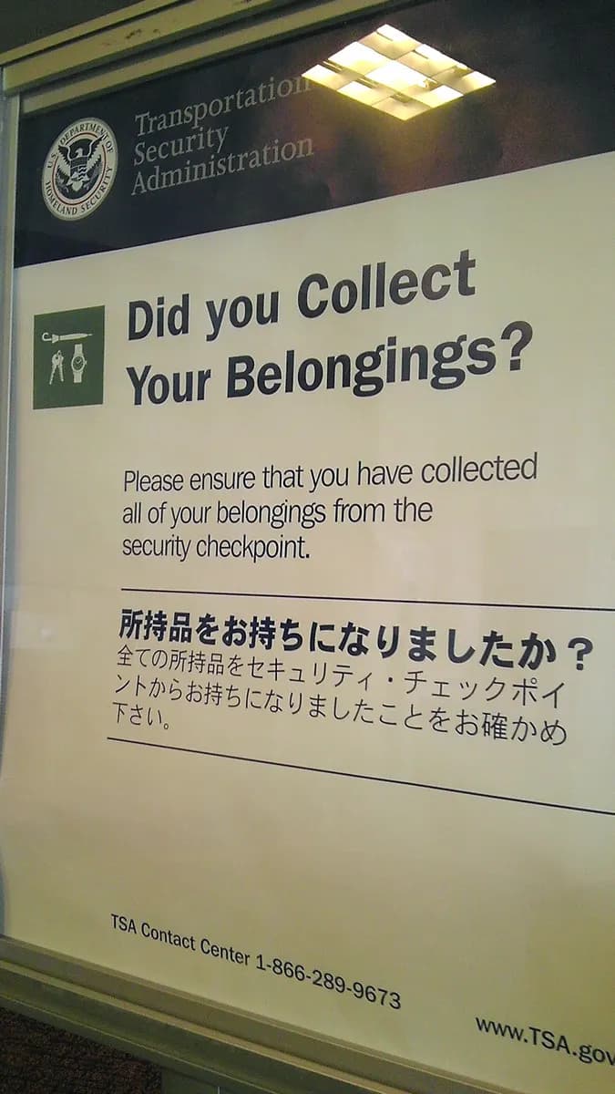 Leftover 2012 bilingual sign at the exit of the Evansville Regional Airport TSA checkpoint.