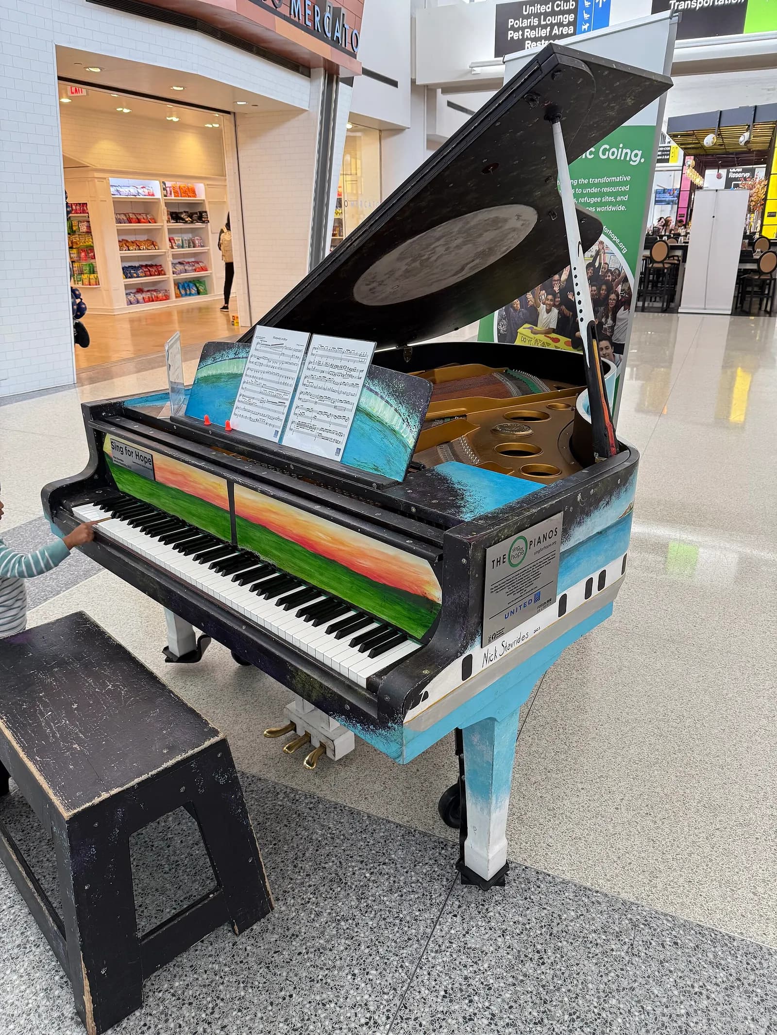 A Sing for Hope Piano within Terminal C of Newark Liberty International Airport in Newark, Essex County, New Jersey