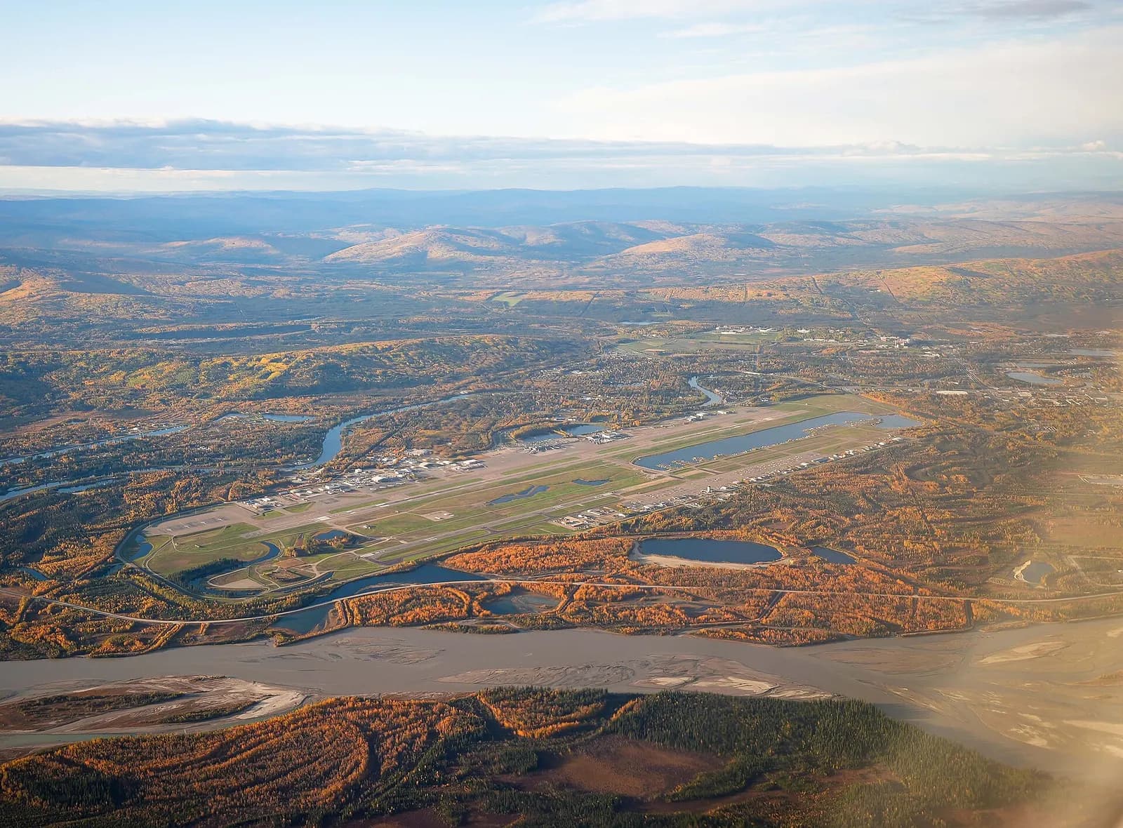 Aerial view of Fairbanks International Airport’s civil terminal, ramp, and parallel runways, 15 September 2021