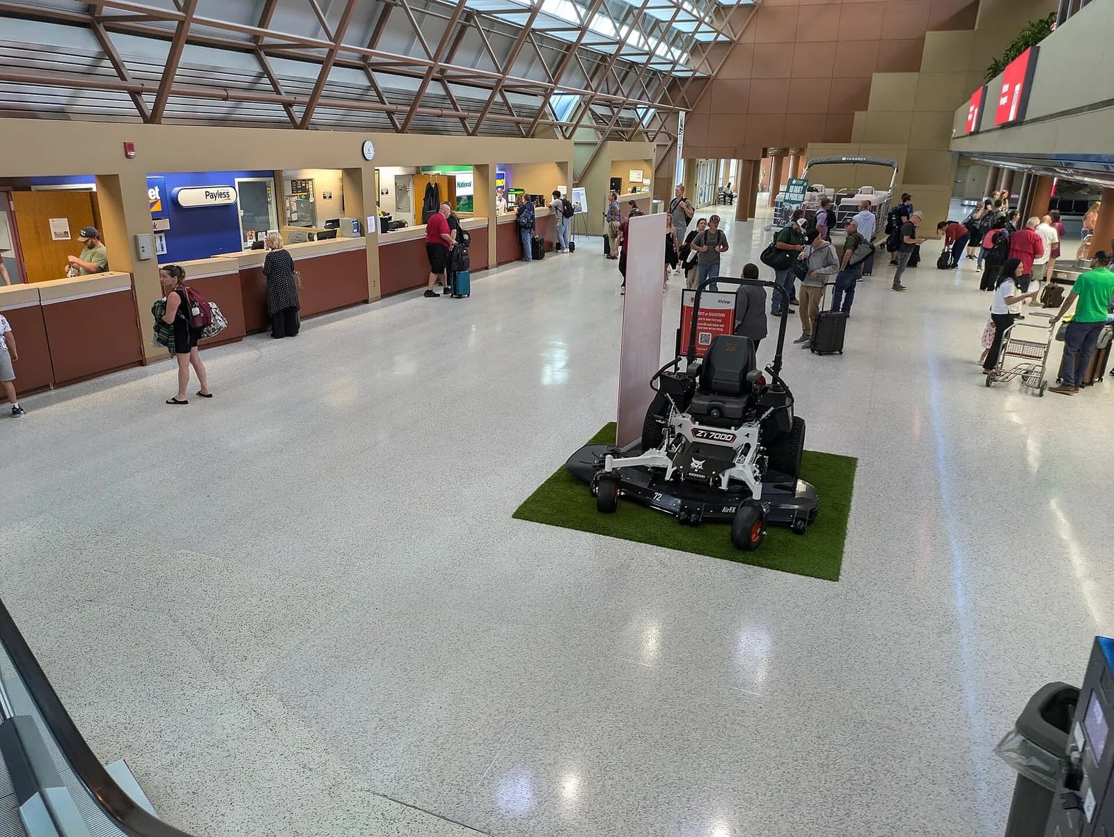 Rental-car counters inside Hector International Airport in August 2024, before the 2026 east-gate opening.