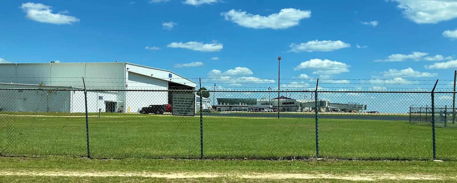 Fayetteville Regional Airport hangars and jet bridges from the airfield side