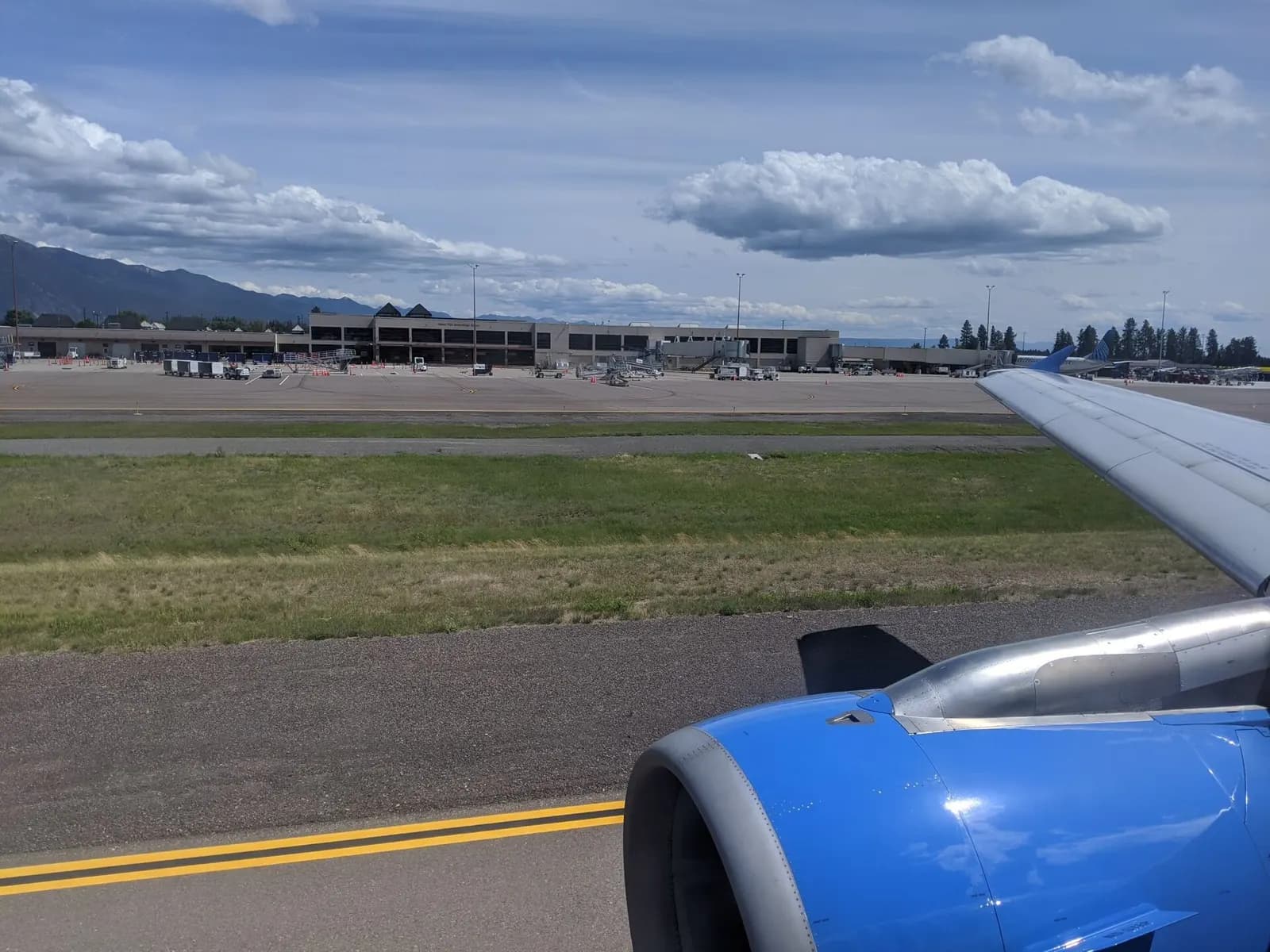 Glacier Park International Airport terminal seen from a departing Allegiant Air plane, 12 July 2020