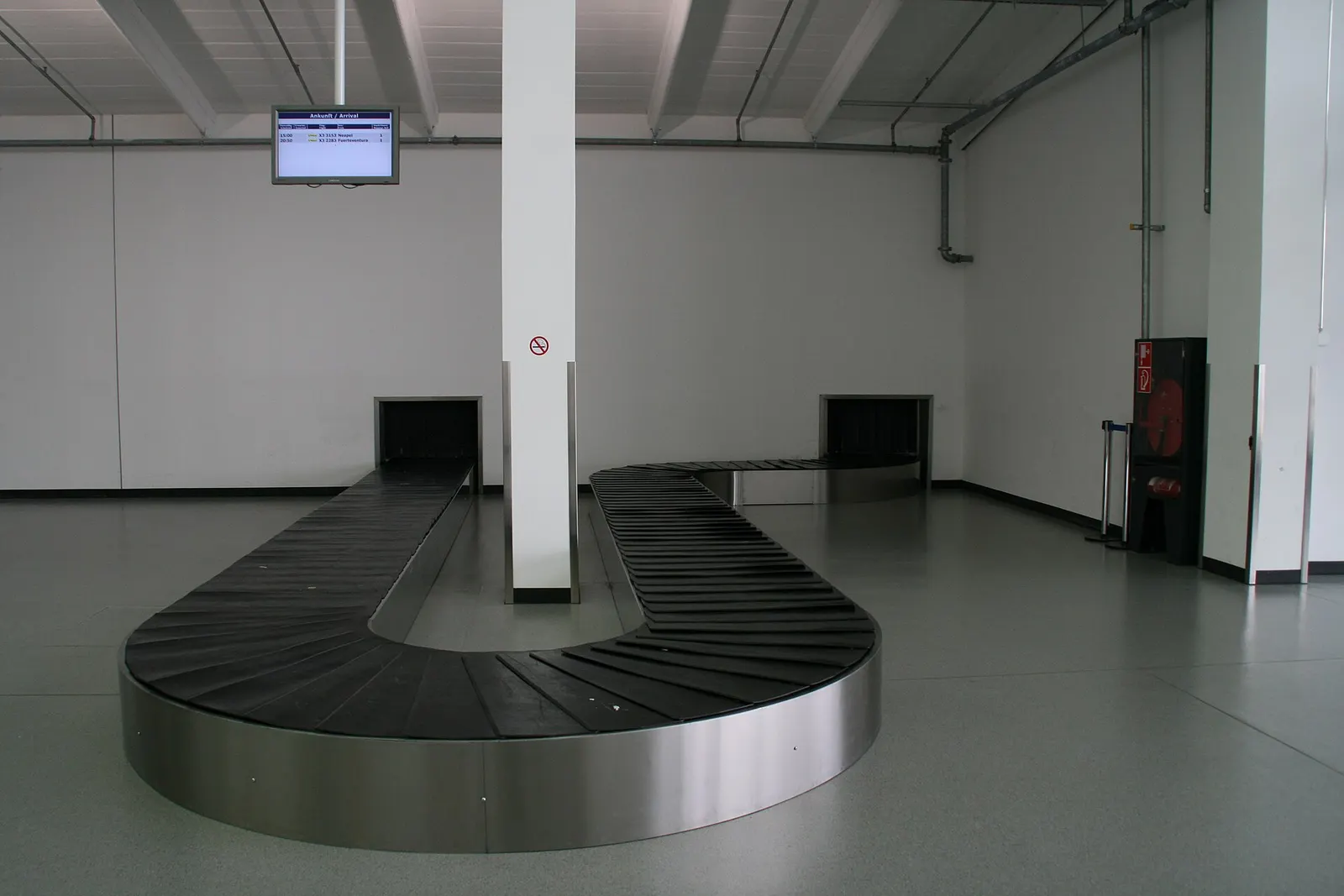 Baggage claim belt inside Memmingen Airport arrivals hall