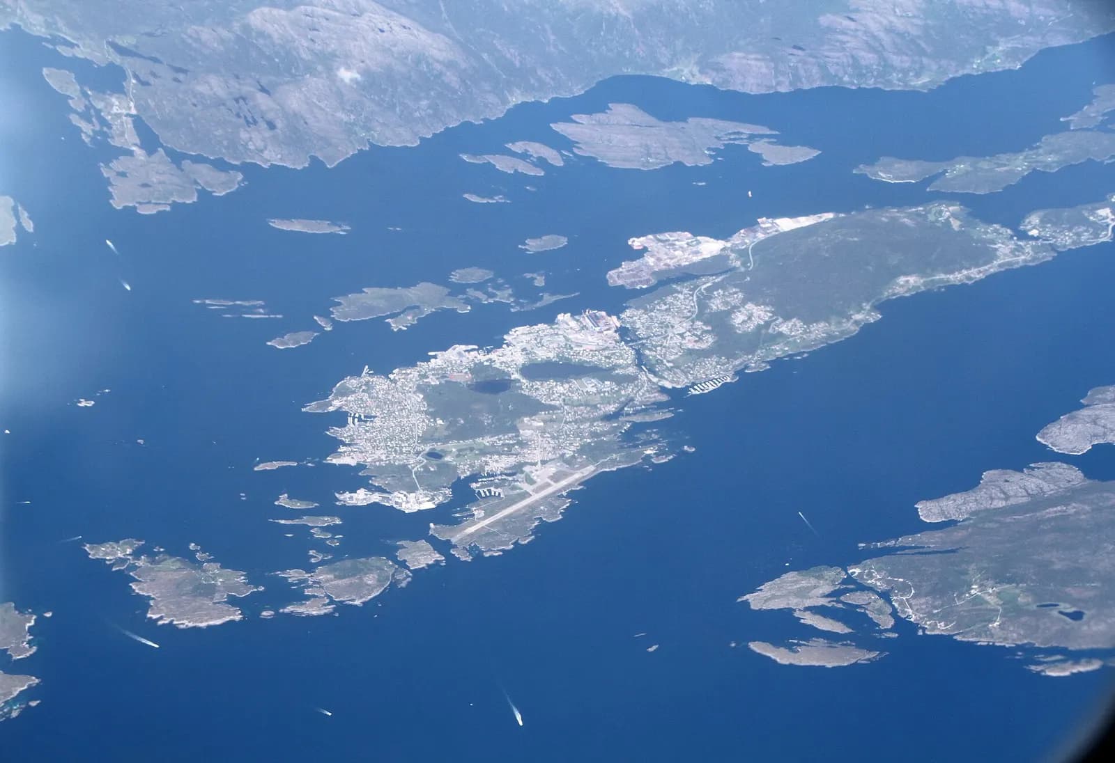 Wide aerial of Florø’s southern shore and airport surroundings on Florelandet.