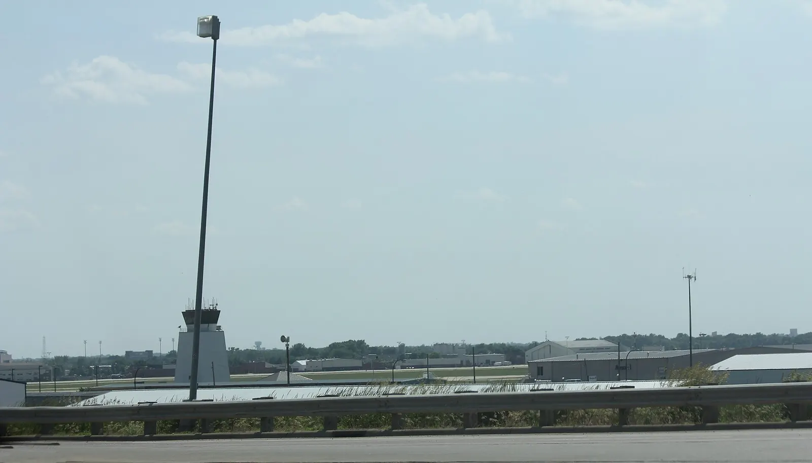 2016 panorama of the Sioux Falls Regional Airport civil terminal and apron from the landside.