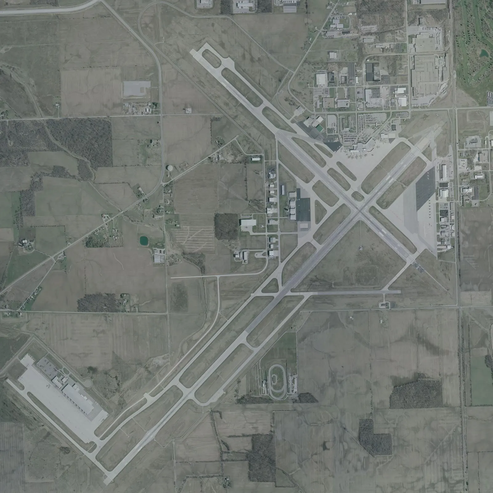 Historic 10 April 2002 USGS aerial of Fort Wayne International Airport — civil campus, not current interiors, not the Gateway Lounge