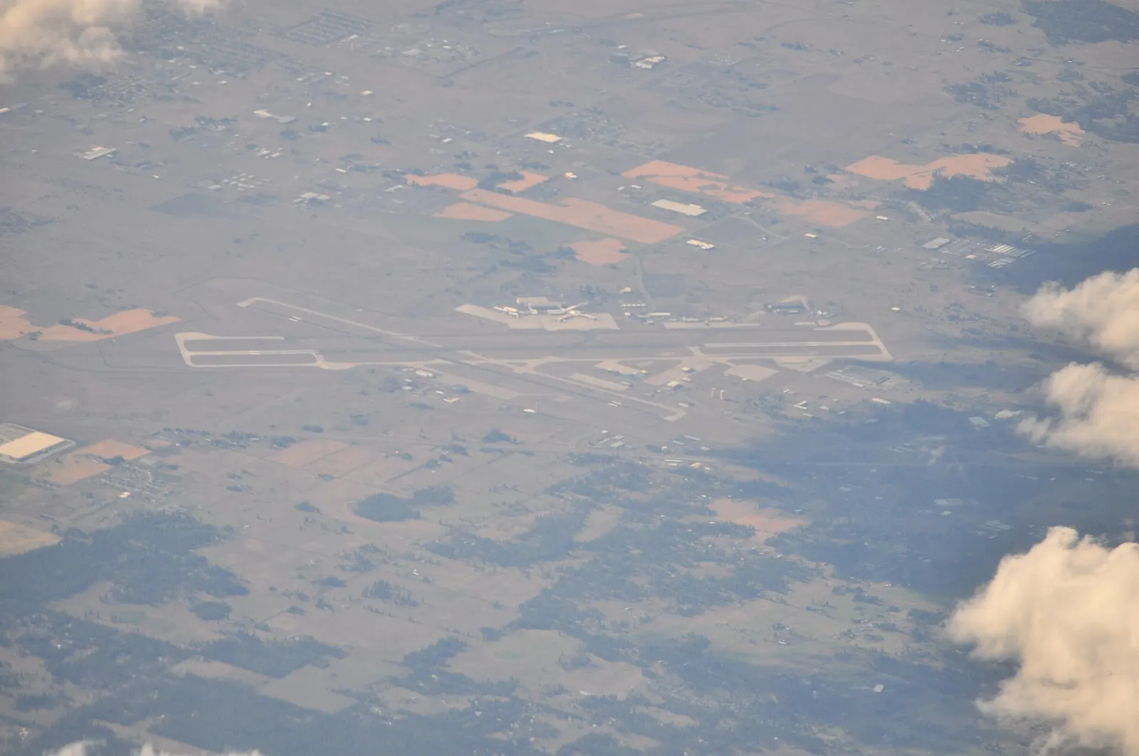Aerial view of Spokane International Airport showing the A/B rotunda and Concourse C campus