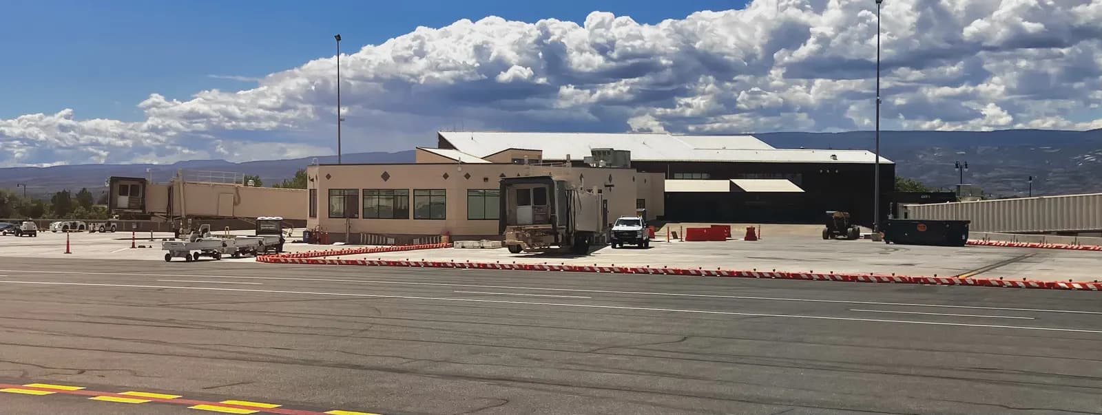 Airside facade of the Grand Junction Regional Airport terminal with jet bridges, May 2025.