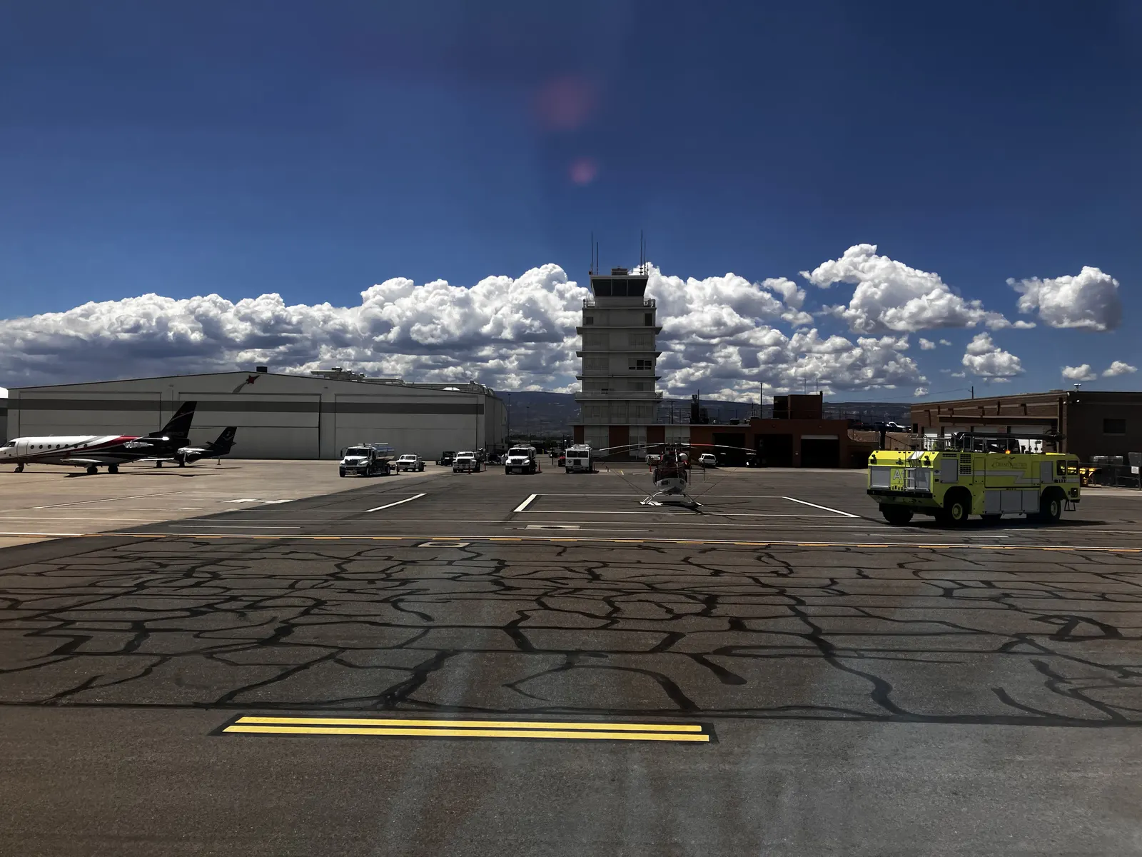 Air traffic control tower at Grand Junction Regional Airport with the Western Slope behind it, May 2025.
