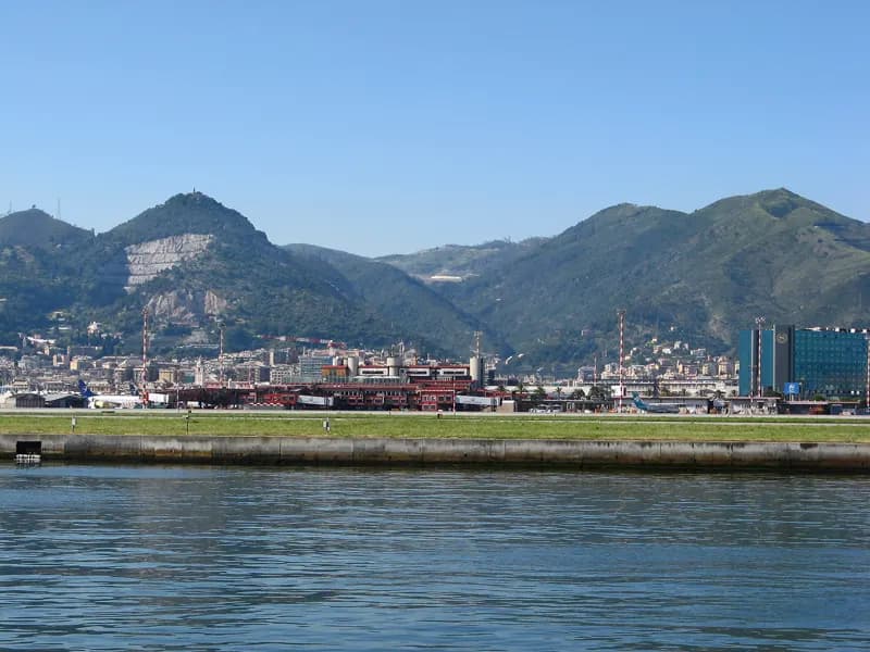 Genoa Cristoforo Colombo Airport terminal and Sheraton hotel seen from the sea wall