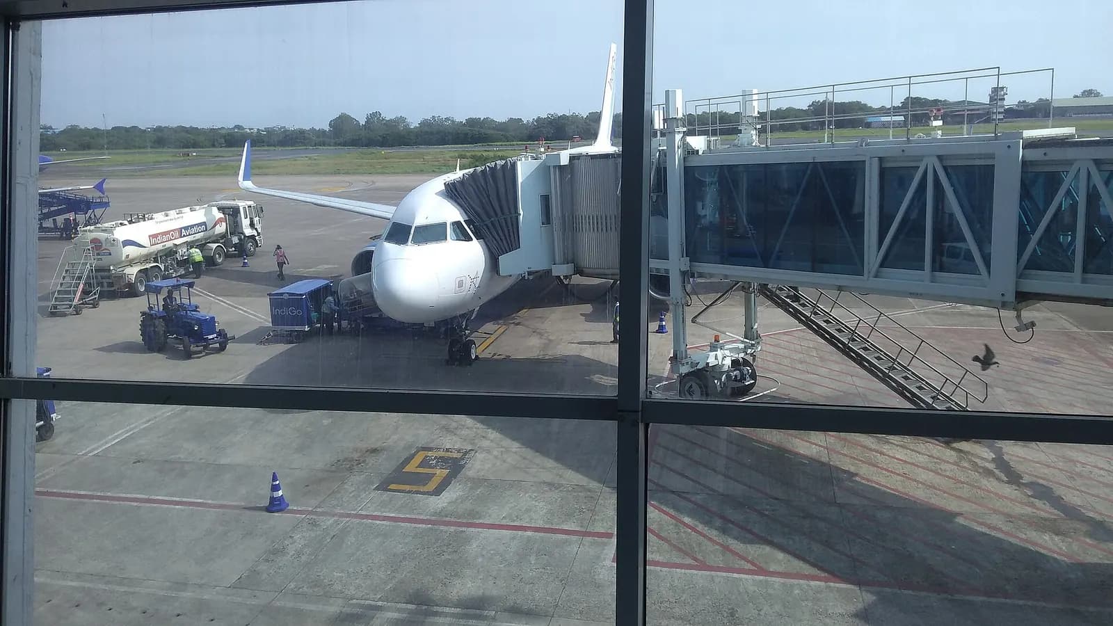Aeroplane awaiting passengers at Goa's Dabolim airport. Photo by Frederick Noronha (FN). Creative Commons, attribution. +91-9822122436 or fredericknoronha2 at gmail.com