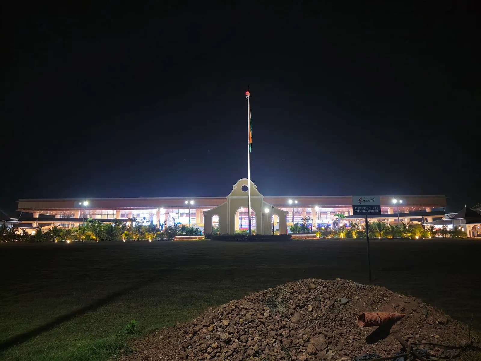 Night view of the GMR Aerocity / terminal district arch at Manohar International Airport (GOX)