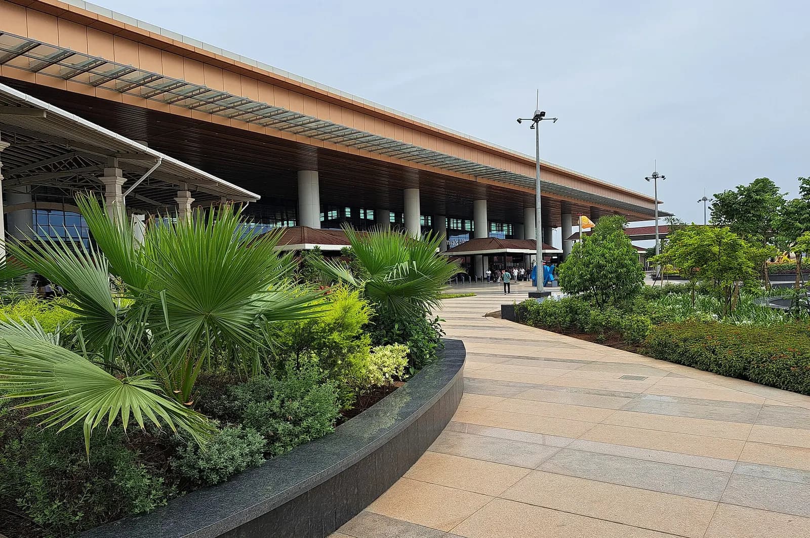 Manohar International Airport (GOX) landside arrivals canopy and landscaped walkway