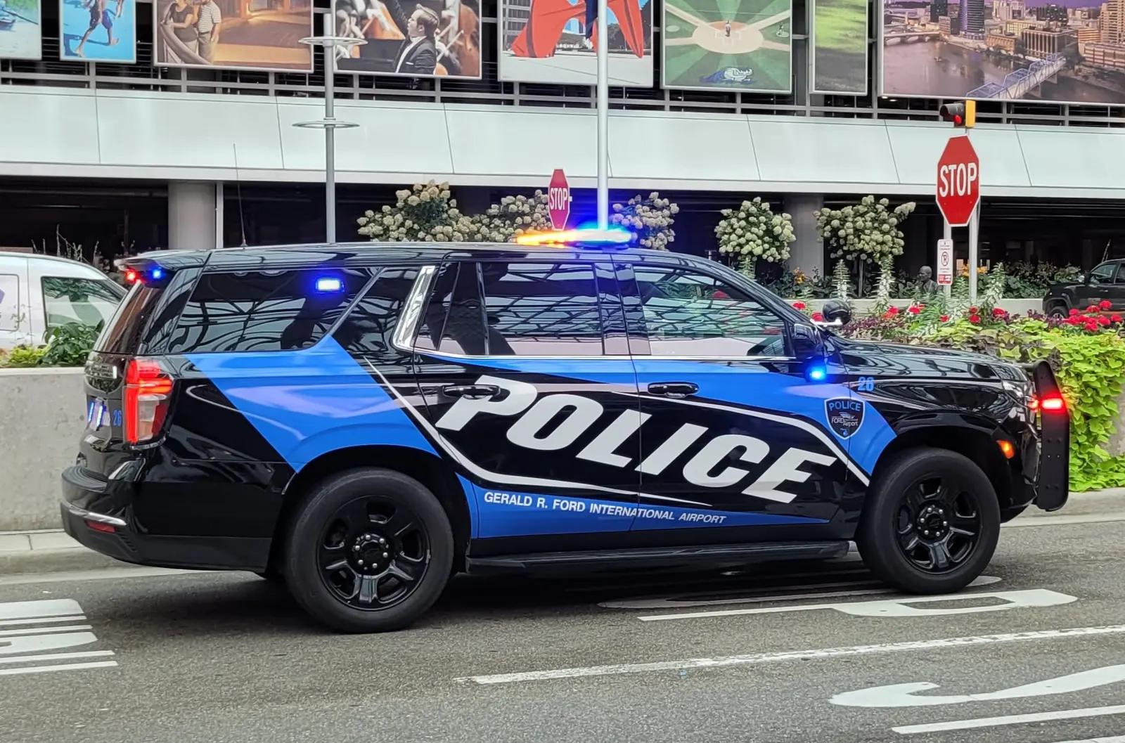 White Gerald R. Ford International Airport Police SUV parked on the airfield apron.