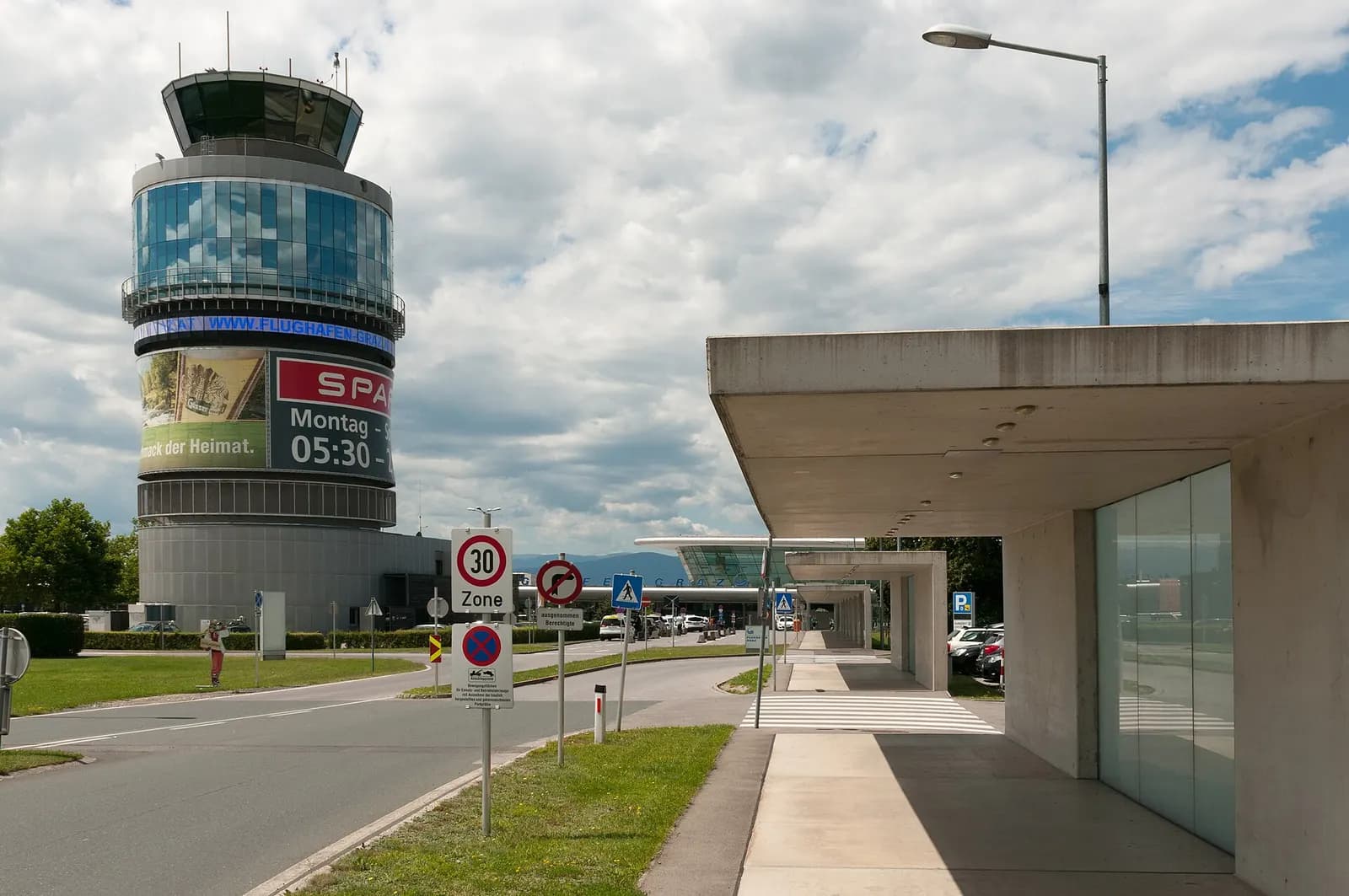 Graz Airport control tower and terminal canopy with FLUGHAFEN GRAZ branding