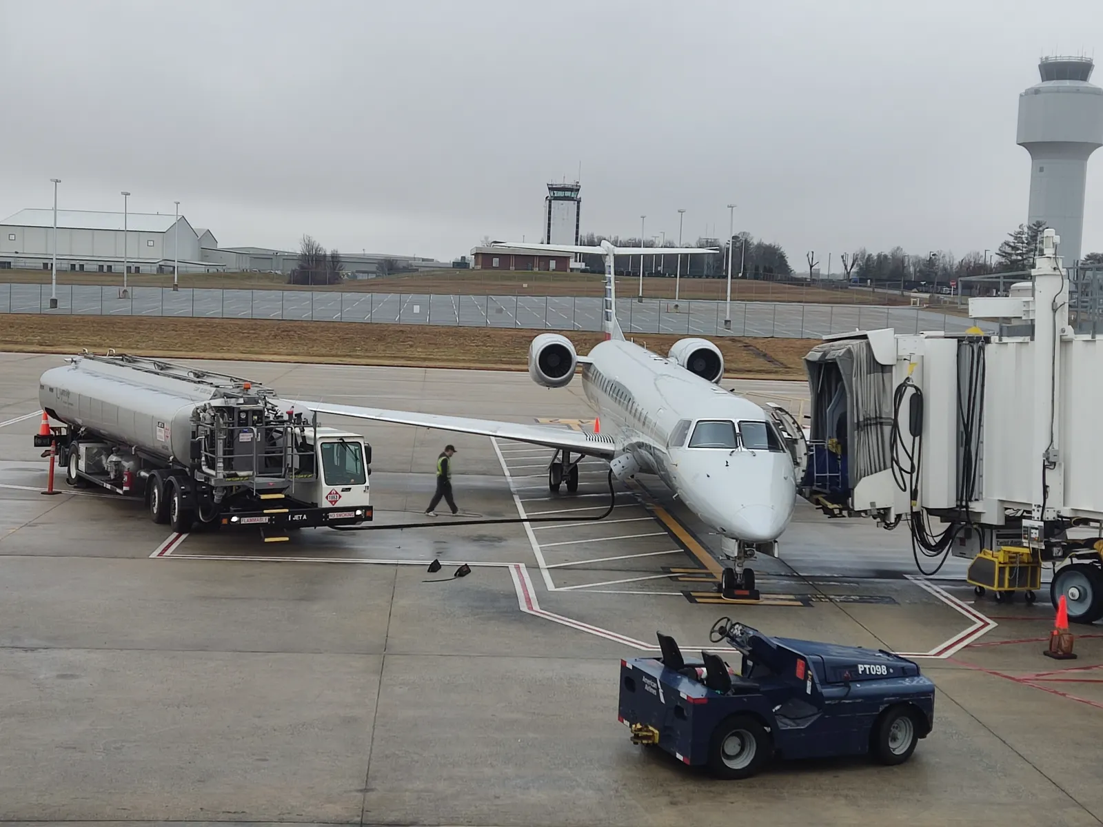 American Eagle Envoy Air ERJ-145LR N931AE parked on the civil ramp at Piedmont Triad International Airport in January 2023.