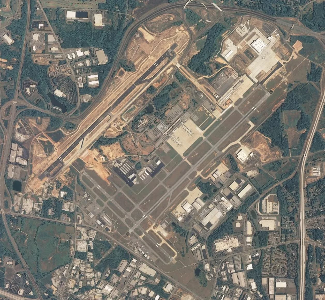 2006 USGS aerial photograph of Piedmont Triad International Airport looking down on the civil terminal and runways.
