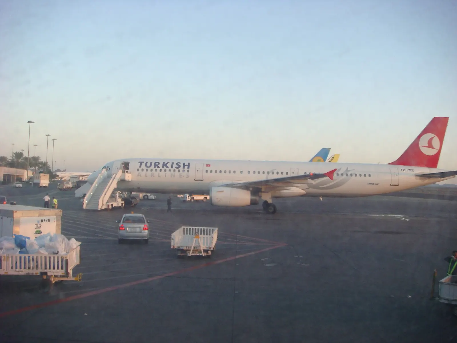 View of Apron on a early Friday morning during the Haj Season. In sight is a scheduled Turkish Airlines bound for Istanbul, with Haj Chartered Uzbekistan Airways, Sudan Airways, Egypt Air and Saudi Airlines in the back ground. Also seen in the picture is the International Arrivals Terminal.