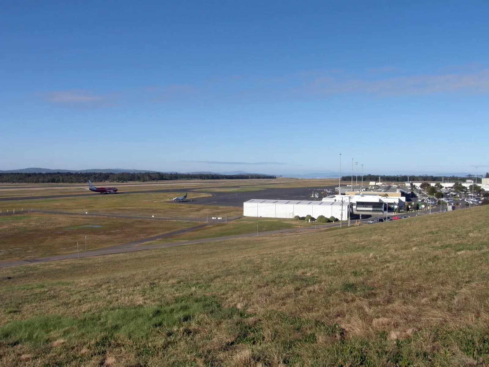 Taken from the Control Tower hill - A Virgin Blue jet taxing towards the Hobart Airport terminal after landing.