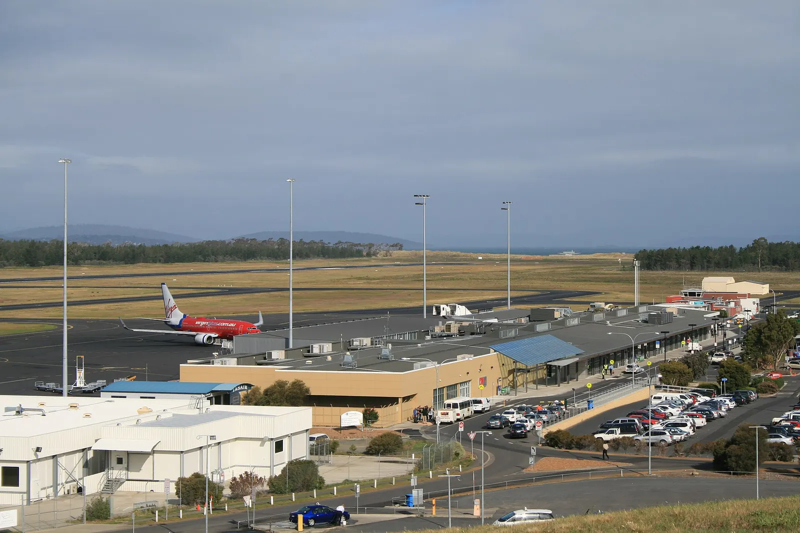 A view of the terminal and apron of Hobart Airport, taken from the hill where the Control Tower is located.