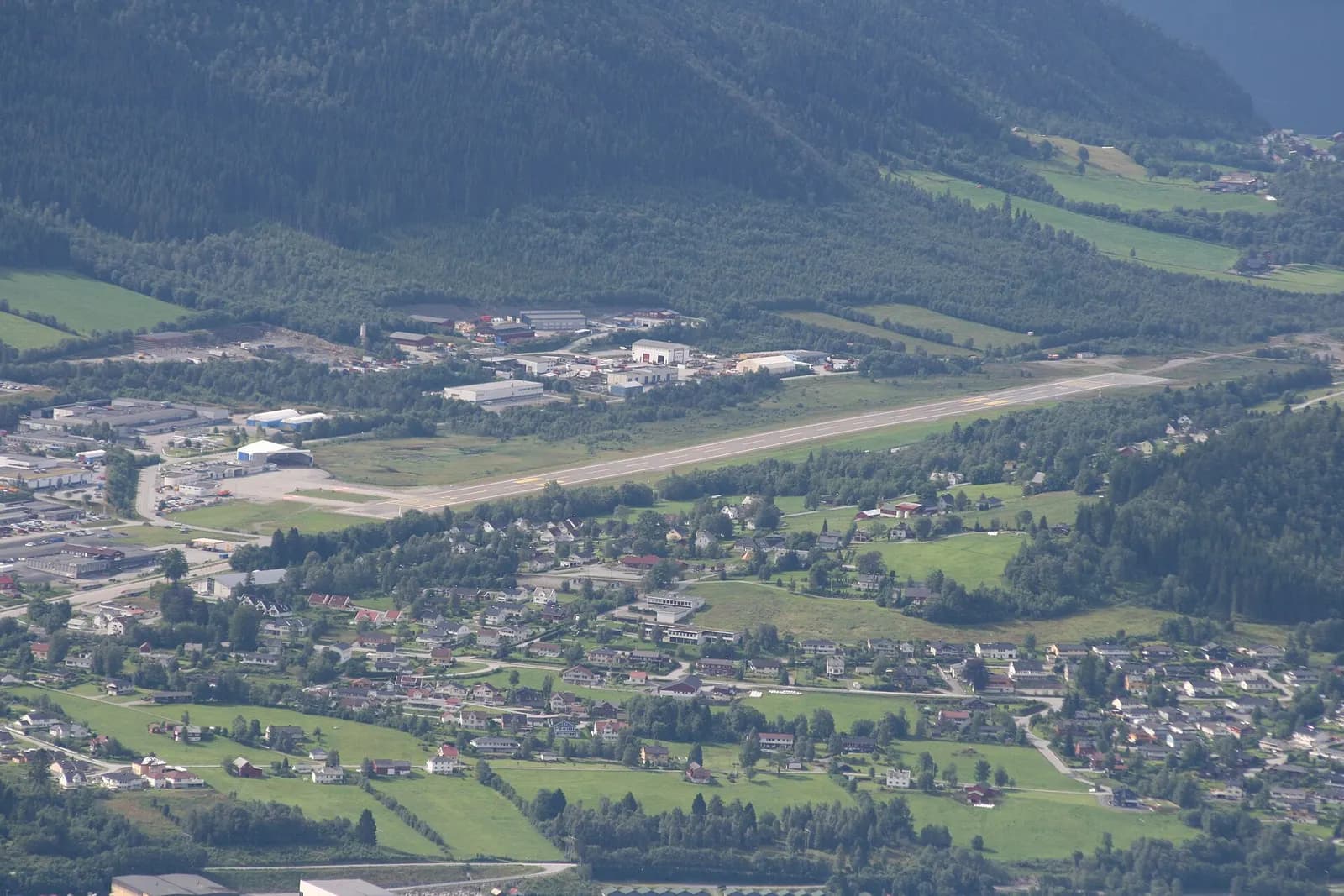 Overview of Ørsta–Volda Airport, Hovden with runway and terminal in the valley