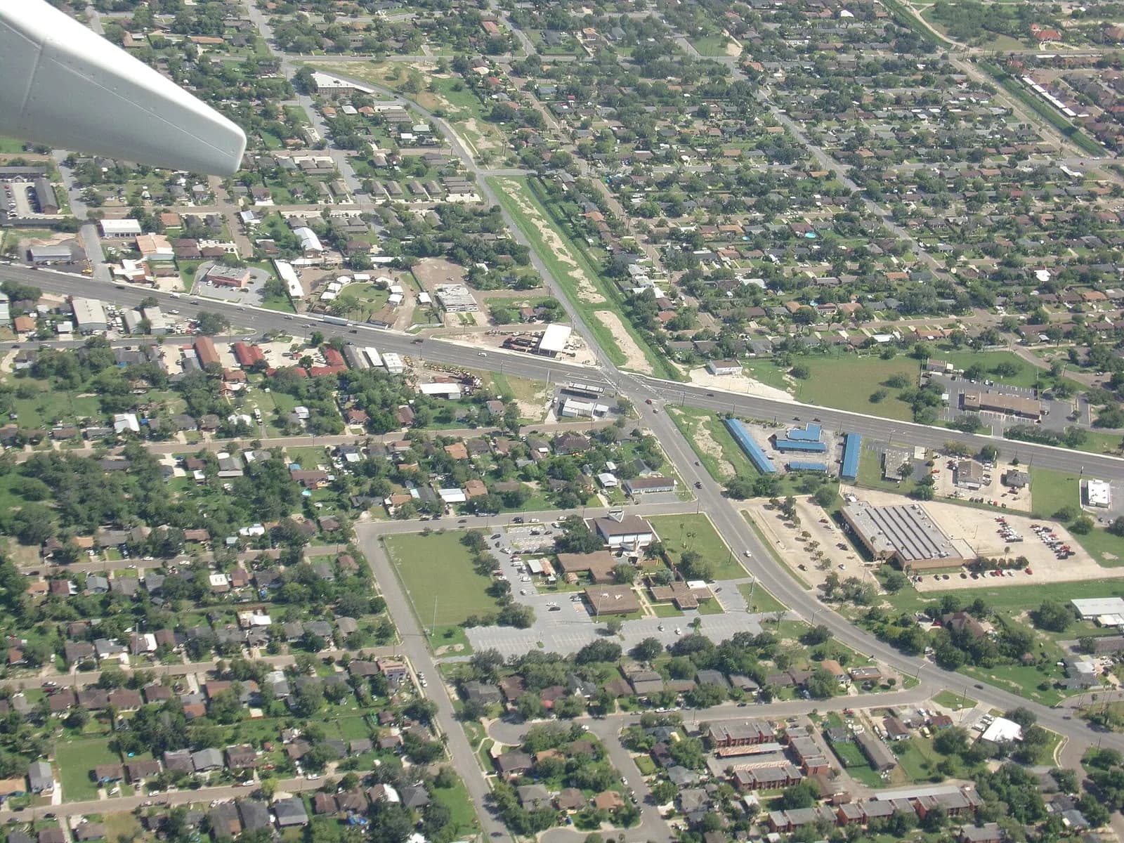 August 2022 aerial of northern Harlingen rooftops and streets after departure from Valley International Airport.