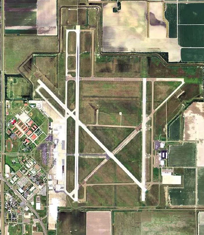2006 USGS aerial of Valley International Airport in Harlingen showing the intersecting civil runways and midfield terminal campus.