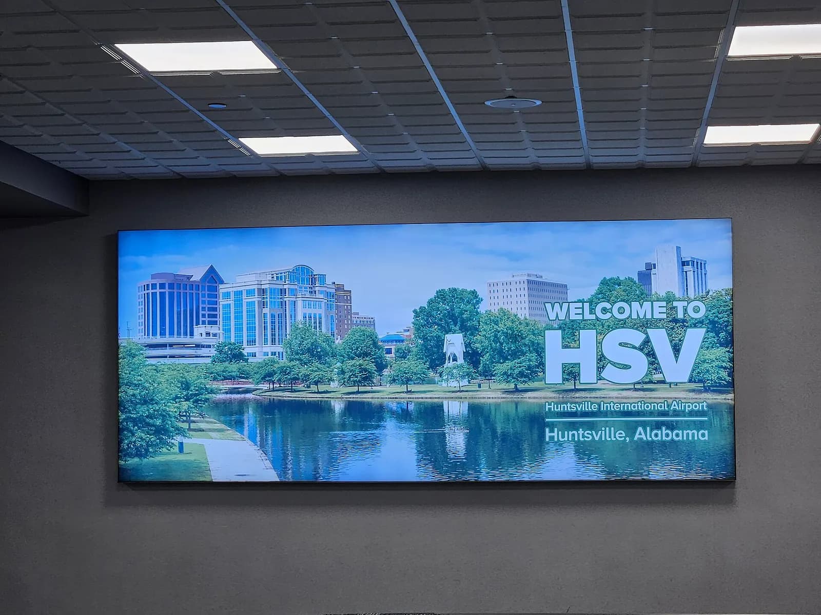 Huntsville International Airport roadside sign photographed in September 2023.