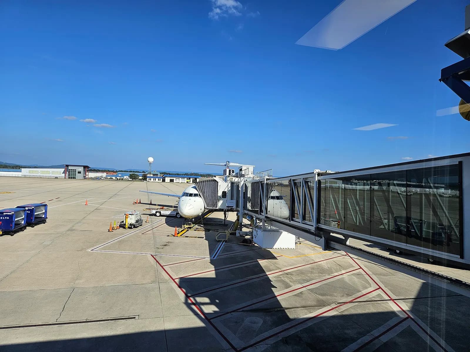 Holdroom seating and windows in the Huntsville International Airport concourse, photographed in August 2023.