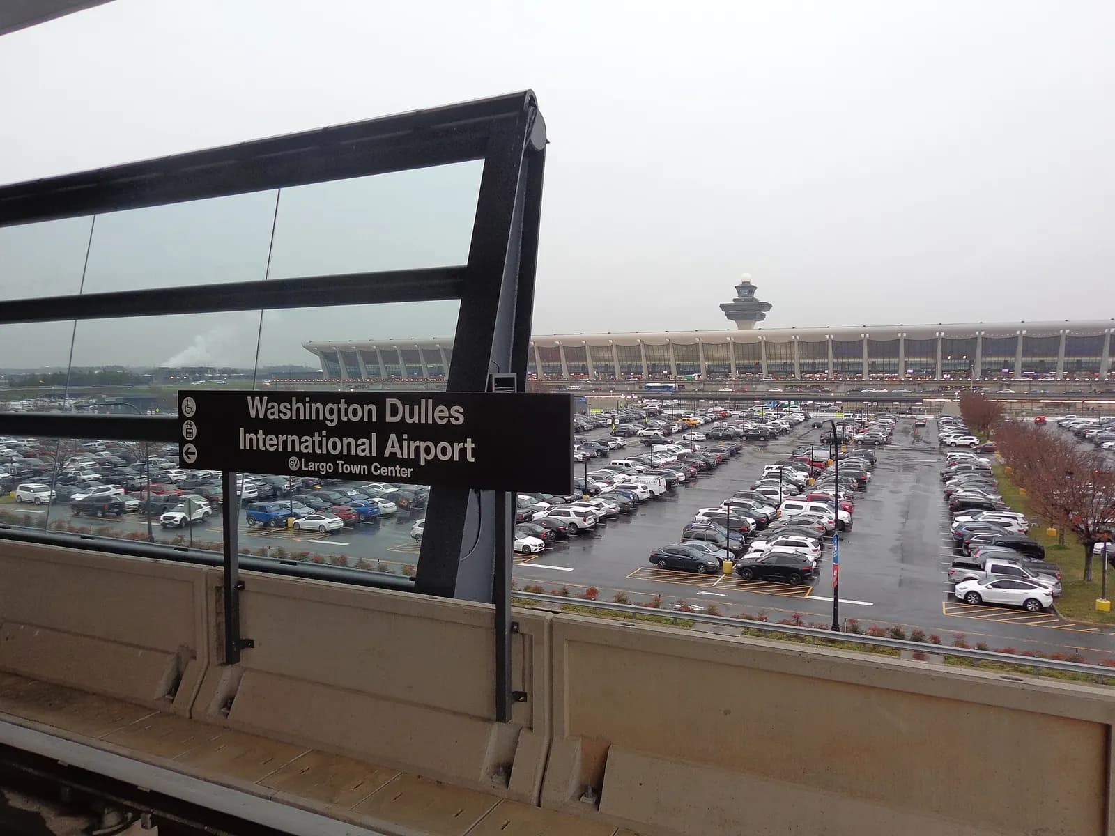 A signpost for the Washington Dulles International Airport station.