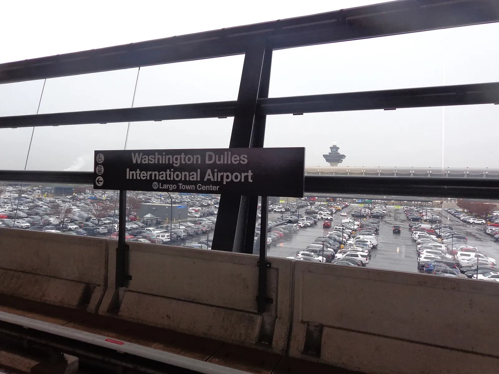 A signpost for the Washington Dulles International Airport station.