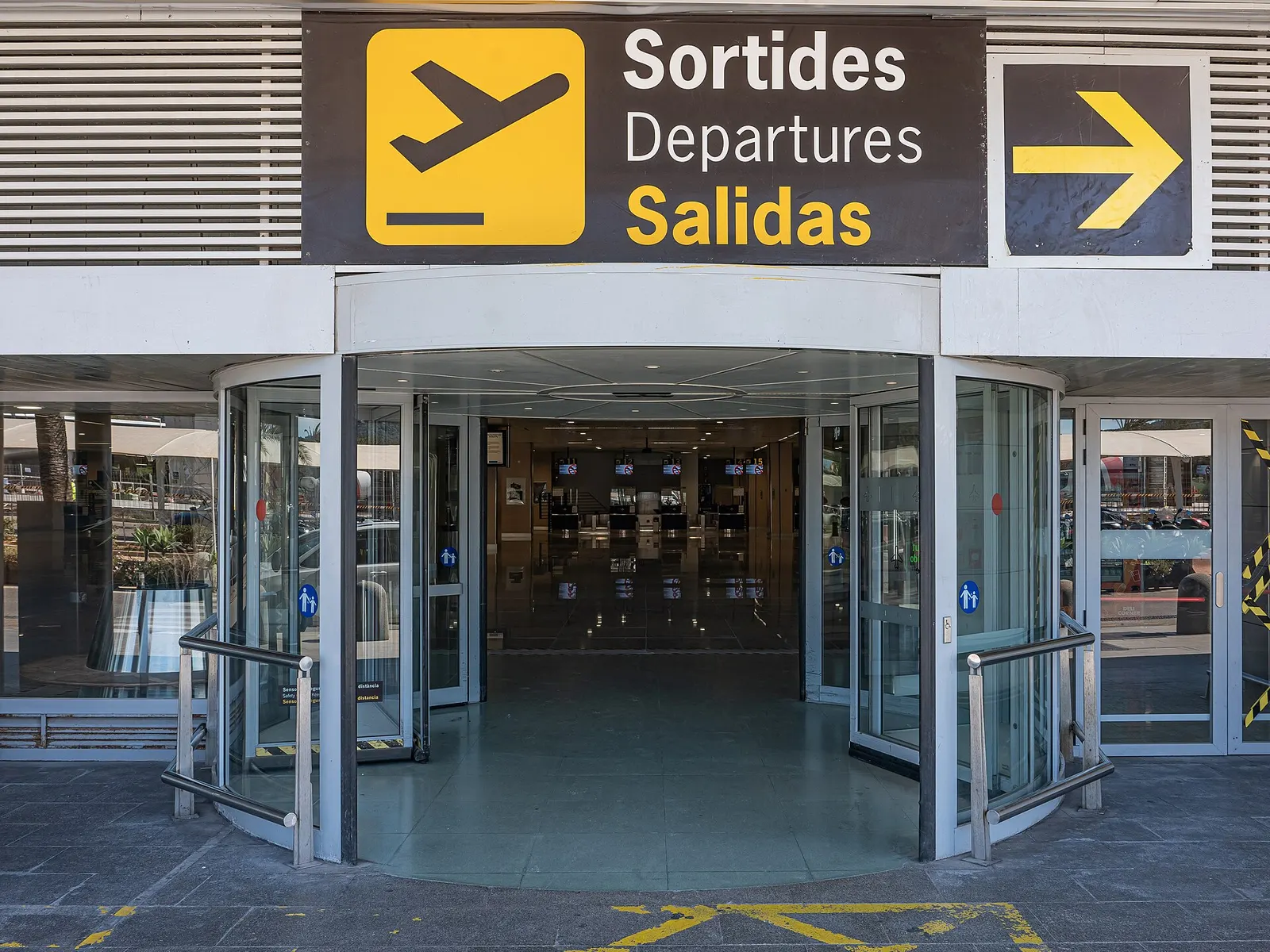 Another angle on Ibiza Airport’s modern terminal exterior.